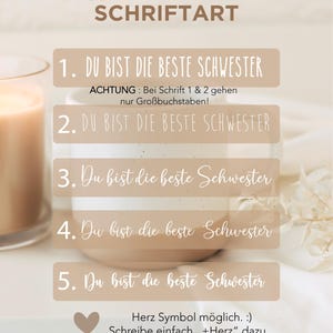 May include: A promotional image with text in German, offering font choices for a design. The text reads "W&Auml;HLE DEINE SCHRIFTART" and lists five options with the phrase "DU BIST DIE BESTE SCHWESTER". A heart symbol is also included.