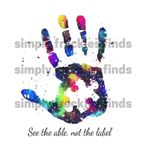 May include: A colorful handprint with a galaxy design and a puzzle piece in the center. The text "See the able, not the label" is below the handprint.