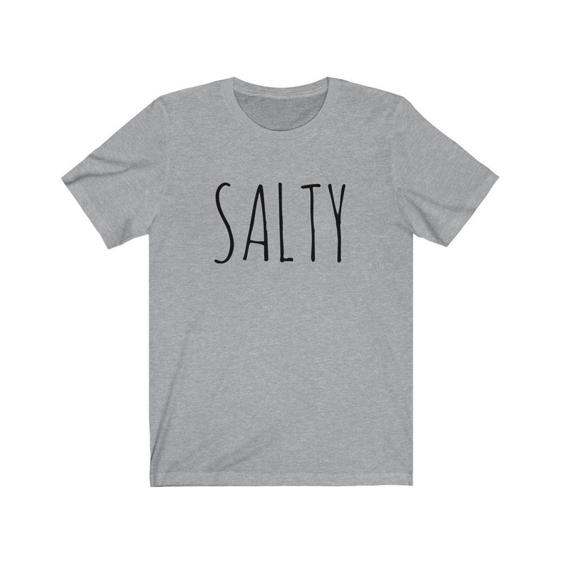 May include: A heather gray t-shirt with the word "SALTY" printed in black.