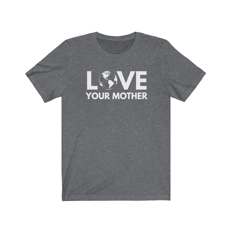 May include: A dark heather grey t-shirt with a white graphic of the Earth and the text "LOVE YOUR MOTHER".