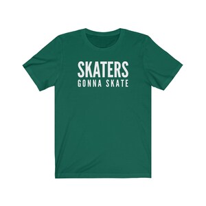 May include: A green t-shirt with white text that reads "SKATERS GONNA SKATE".