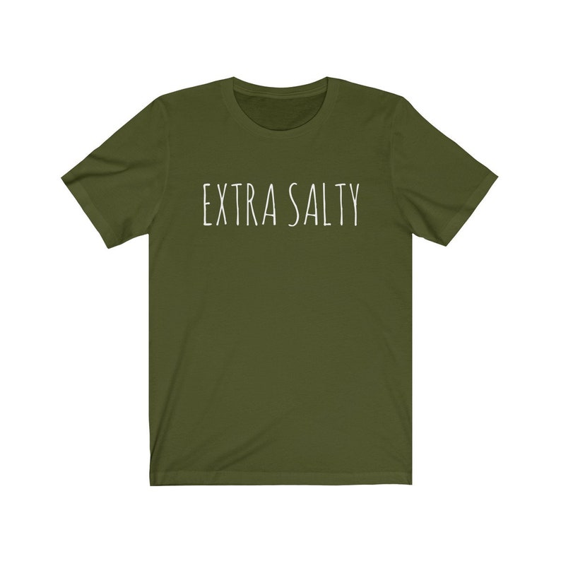 May include: A green short-sleeved t-shirt with the text "EXTRA SALTY" printed in white on the front.