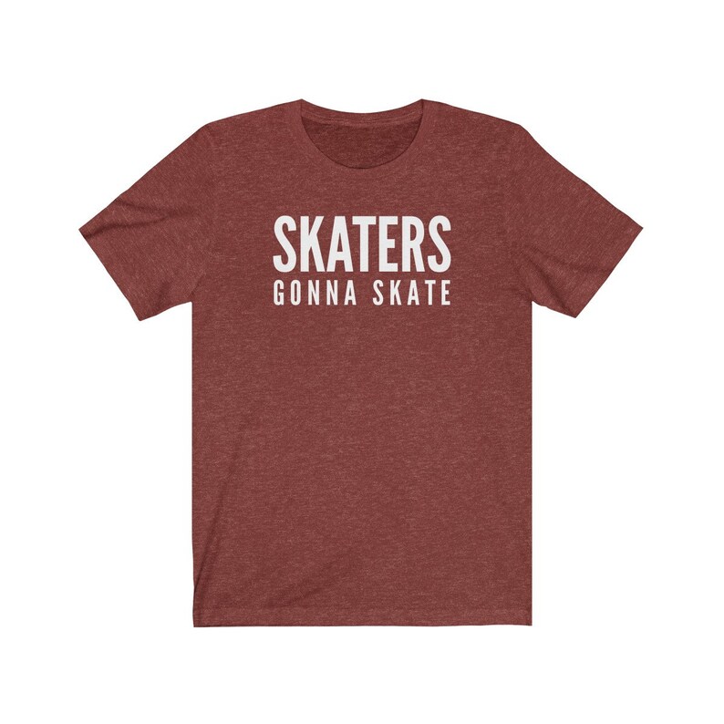 May include: A maroon heather t-shirt with white text that reads "SKATERS GONNA SKATE".