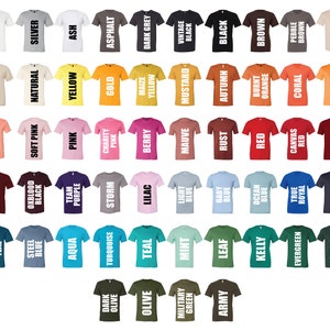 May include: A collection of various colored t-shirts, each displaying a different color name in white block letters. Colors range from white, black, and grey to vibrant hues like yellow, pink, and blue. The shirts are arranged in rows and columns.
