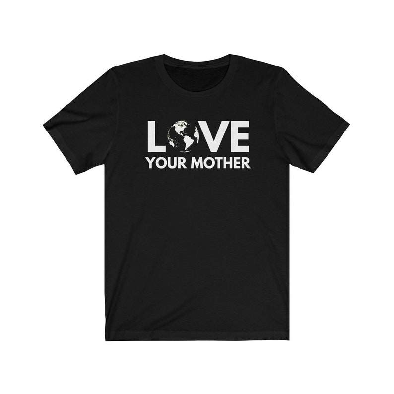 May include: Black t-shirt with white text that reads "LOVE YOUR MOTHER" with an image of the Earth in the middle of the word "LOVE".