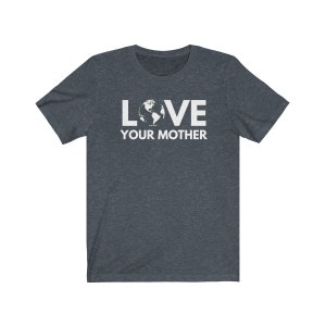 May include: A dark heather grey t-shirt with a white graphic of the Earth and the text "LOVE YOUR MOTHER".