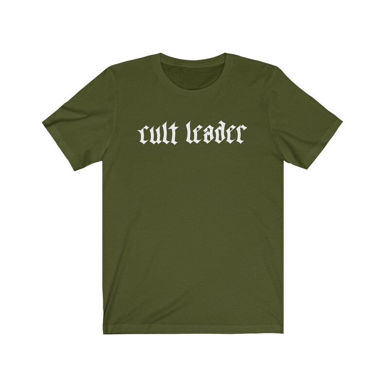 May include: A green short-sleeved t-shirt with the text "cult leader" in white gothic lettering.