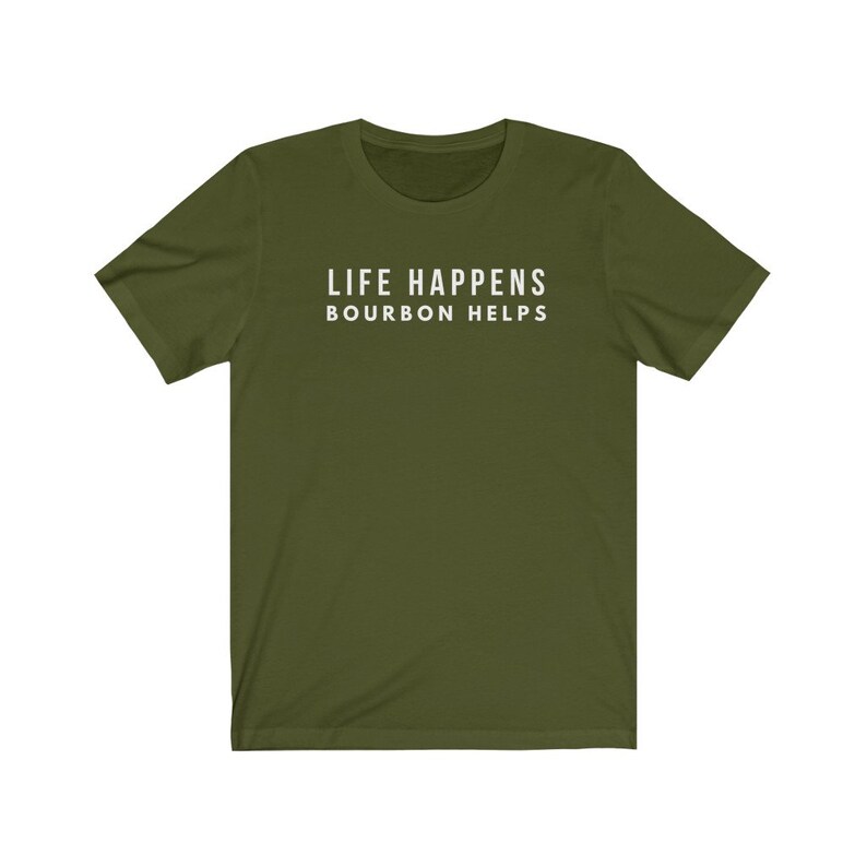 May include: A green short-sleeved t-shirt with the text "LIFE HAPPENS BOURBON HELPS" printed in white on the front.