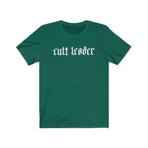 May include: A dark green t-shirt with the text "cult leader" in white gothic font.