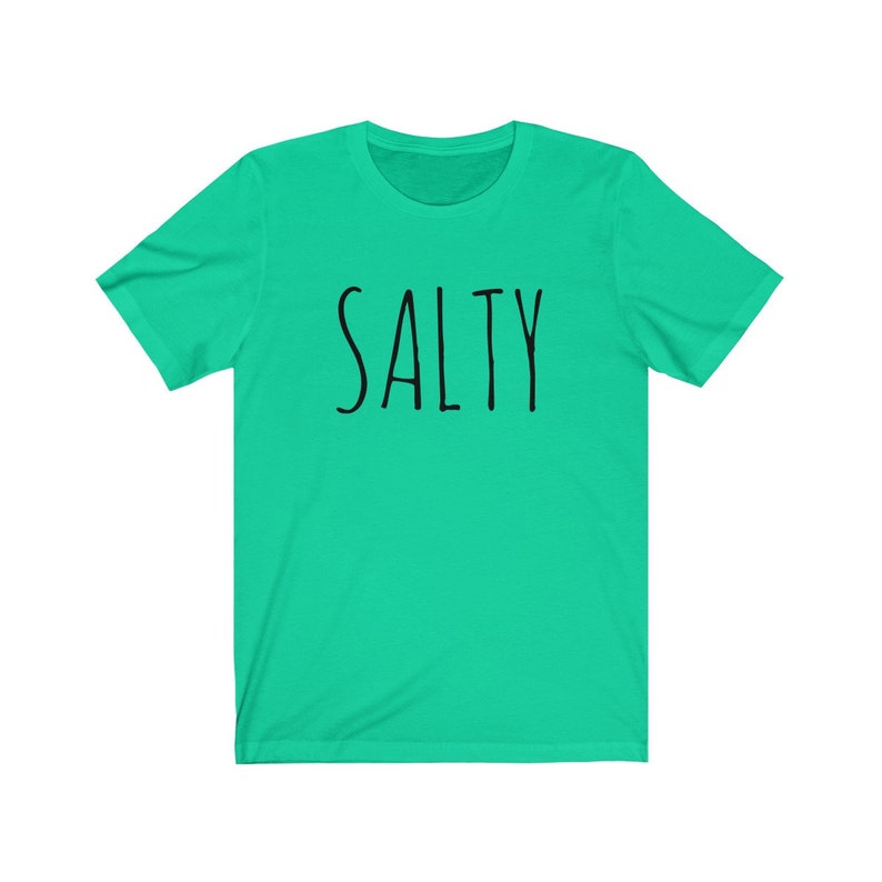 May include: A turquoise blue t-shirt with the word "SALTY" printed in black.