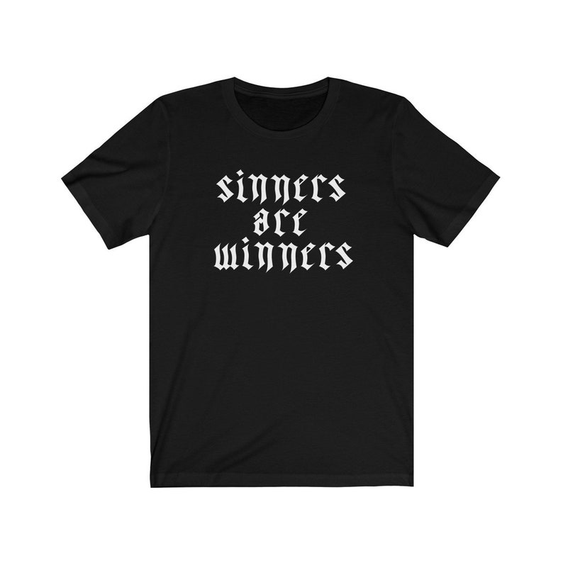 May include: Black t-shirt with white text that reads "sinners are winners" in a gothic font.
