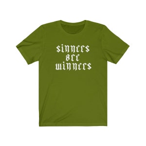 May include: A green t-shirt with the text "sinners are winners" in white gothic font.