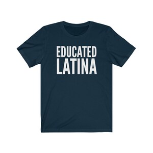 May include: Navy blue t-shirt with white text that reads "EDUCATED LATINA".