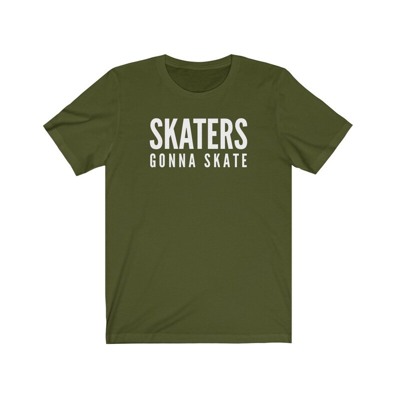 May include: A green short-sleeved t-shirt with the text "SKATERS GONNA SKATE" in white.