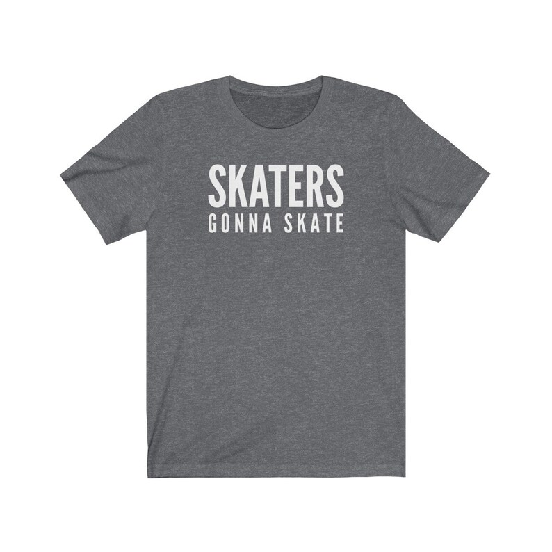 May include: A dark heather grey t-shirt with white text that reads "SKATERS GONNA SKATE".
