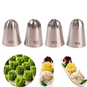 May include: Four stainless steel piping tips with different designs. The tips are numbered 901, 902, 903, and 904. A close-up of green frosting piped into a swirl design is shown in the bottom left corner.