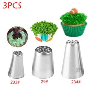 May include: Three silver metal piping tips for decorating cakes and cupcakes. The tips have a star-shaped design with multiple points. The tips are labeled 233#, 29#, and 234#.