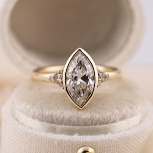 Marquise cut engagement ring lab diamond bezel set ring 14k solid gold engagement ring with side stones and tapered band IGI certified