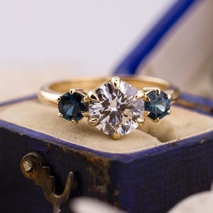 Round cut three stone engagement ring with sapphire side stones lab grown diamond 2 carat 14k solid gold IGI certified lab grown diamond
