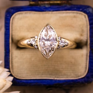 Marquise cut engagement ring lab diamond bezel set ring 14k solid gold engagement ring with side stones and chunky band IGI certified