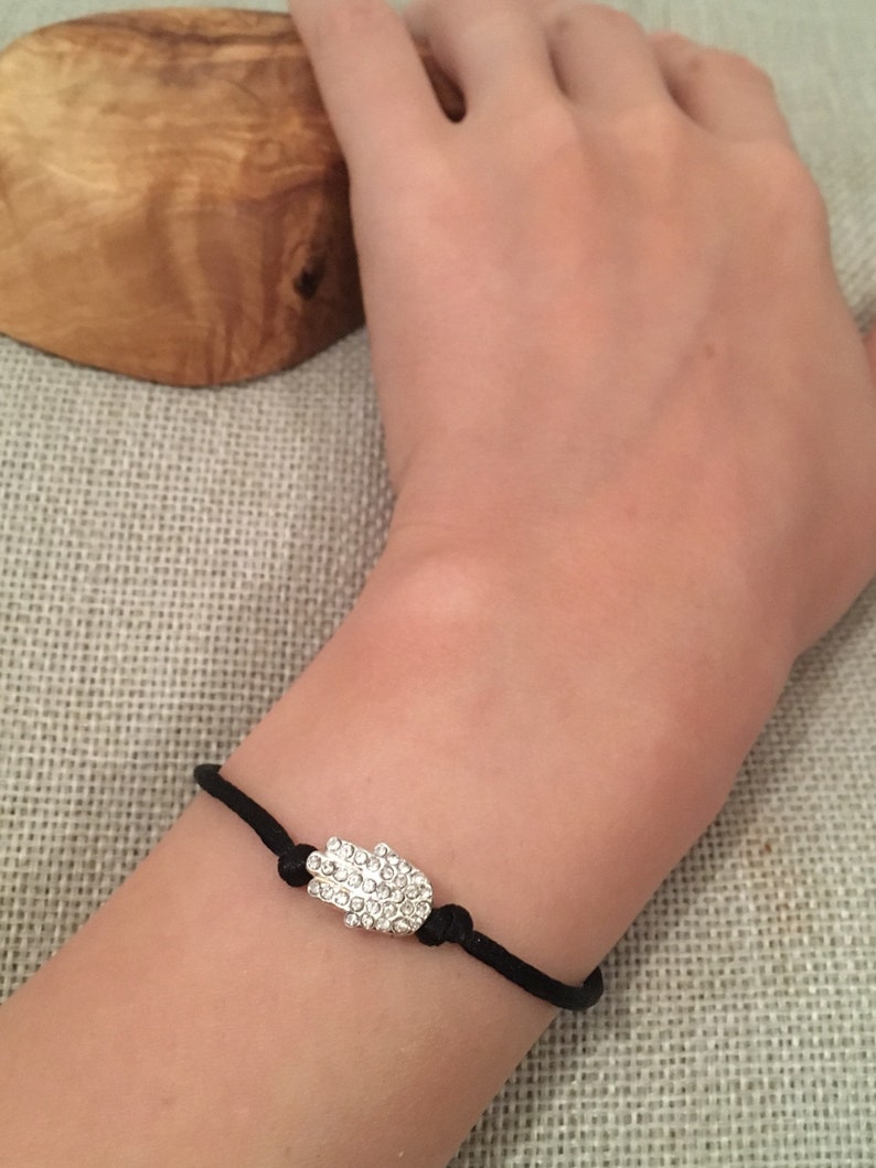 Hamsa hand of Fatima silver bracelet set with Rhinestones adjustable black cord
