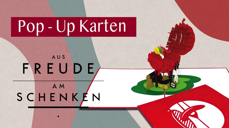 Puede incluir: Una tarjeta roja pop-up con una barbacoa 3D y comida. La tarjeta dice "Pop-Up Karten aus Freude am Schenken".