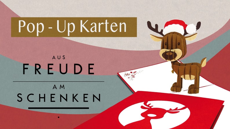 May include: A red and white pop-up card with a reindeer wearing a Santa hat. The card says "Pop-Up Karten aus Freude am Schenken".