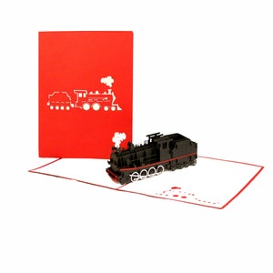 Puede incluir: Una tarjeta emergente roja y blanca con un tren de vapor 3D negro con una franja roja. La tarjeta est&aacute; abierta y el tren est&aacute; levantado.