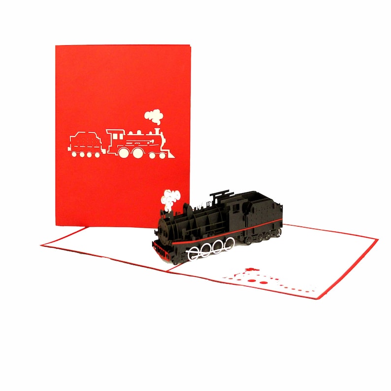 Puede incluir: Una tarjeta emergente roja y blanca con un tren de vapor 3D negro con una franja roja. La tarjeta est&aacute; abierta y el tren est&aacute; levantado.