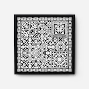 May include: Black and white framed artwork featuring a geometric pattern with intricate details. The design is made up of repeating squares and stars.