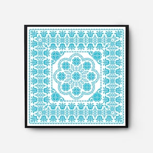 May include: A framed artwork featuring a blue and white geometric pattern with a floral design in the center. The pattern is reminiscent of traditional embroidery.