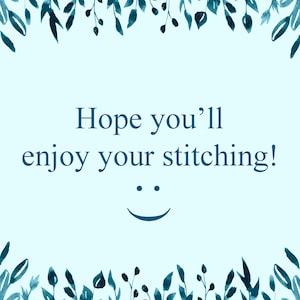 May include: A light blue background with a watercolor border of green leaves. The text "Hope you'll enjoy your stitching!" is written in dark blue with a smiling face below the text.