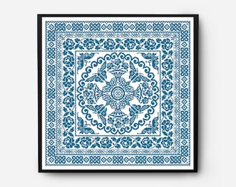 May include: A framed artwork featuring a blue and white geometric pattern with a central motif of stylized butterflies and floral elements.