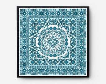 May include: Square framed artwork featuring a teal and white floral pattern. The design includes a central circular motif surrounded by intricate floral and scrollwork. The artwork is framed in a black square frame.
