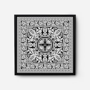 Op de afbeelding: Zwart-witte ingelijste wandkunst met een geometrisch patroon met bloemmotieven.
