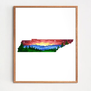 May include: Cross stitch pattern of the state of Tennessee with a sunset over a lake and mountains. The pattern is in a frame and the text "Cross stitch PDF" is below the frame.