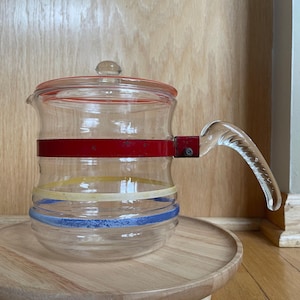 Vintage Glasbake McKee Glass Coffee Pot with Molded Handle and Red Metal Band and decorative Red Yellow and Blue painted stripes