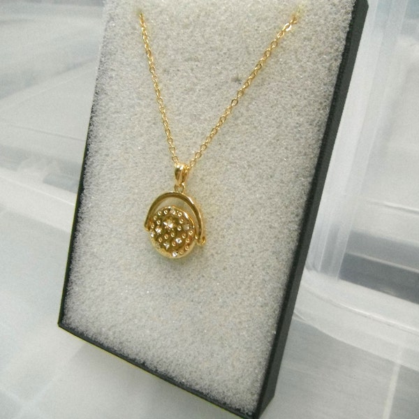 Starlight Spinner gouden ster ketting cadeau verpakt