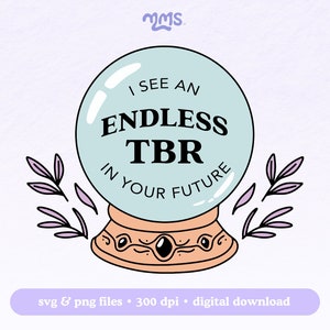May include: A blue and white crystal ball with the text "I see an endless TBR in your future" inside. The crystal ball is on a stand with a gold base and black gems. Two purple sprigs are on either side of the crystal ball.