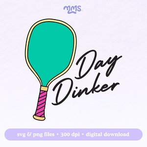 May include: A green and yellow paddleball paddle with a pink handle. The text "Day Dinker" is written in black cursive.