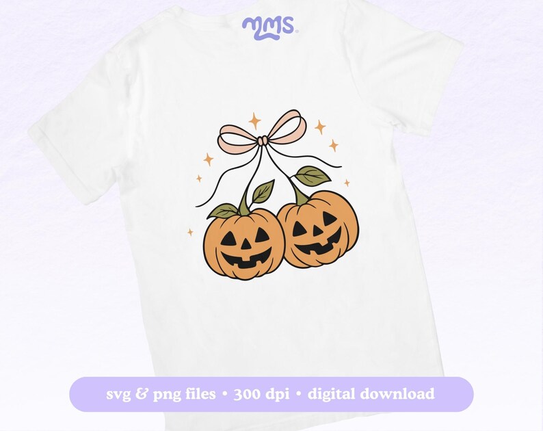 May include: White t-shirt featuring a cartoon illustration of two orange pumpkins with carved faces, connected by green stems and a pink bow. The design includes small star accents. Text at the bottom reads "svg & png files &bull; 300 dpi &bull; digital download."
