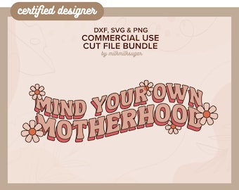 May include: A pink and white graphic design with the text "MIND YOUR OWN MOTHERHOOD" in a retro font style. The design is surrounded by small pink flowers.