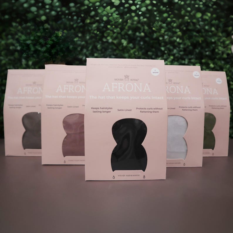 May include: Five satin-lined sleep caps in different colors, including black, brown, pink, gray, and green. The caps are labeled "AFRONA" and say "The hat that keeps your curls intact".