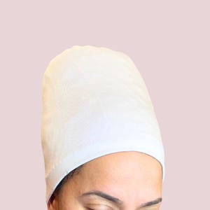 White Afrona in crown style. curls are fully covered and protected