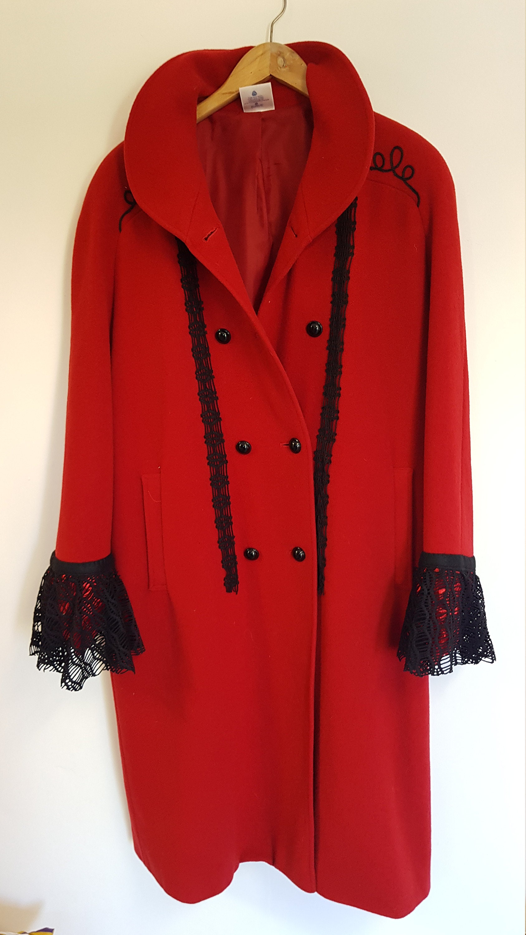 Eastex winter coat restructured by adding lace onto the sleeves and 2 strips of lace down the front panel.