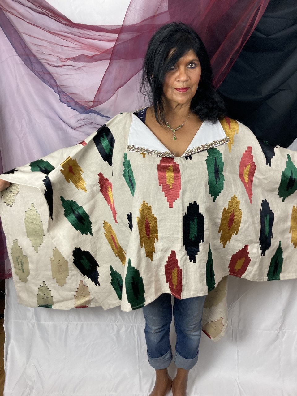 Hand made poncho with embellishment.