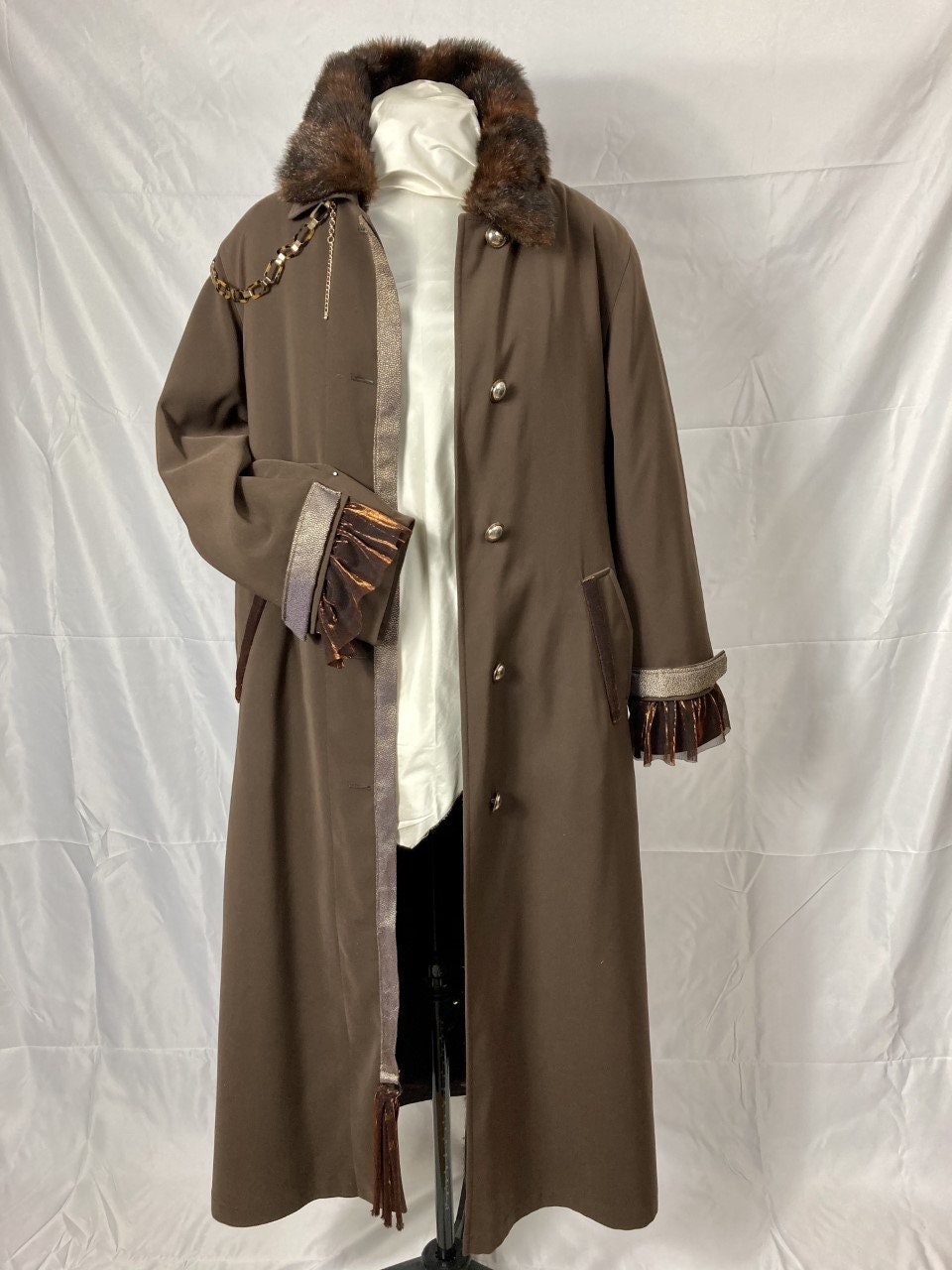 A unique trendy coat for all seasons with removable faux fur lining. (Size 10/12)