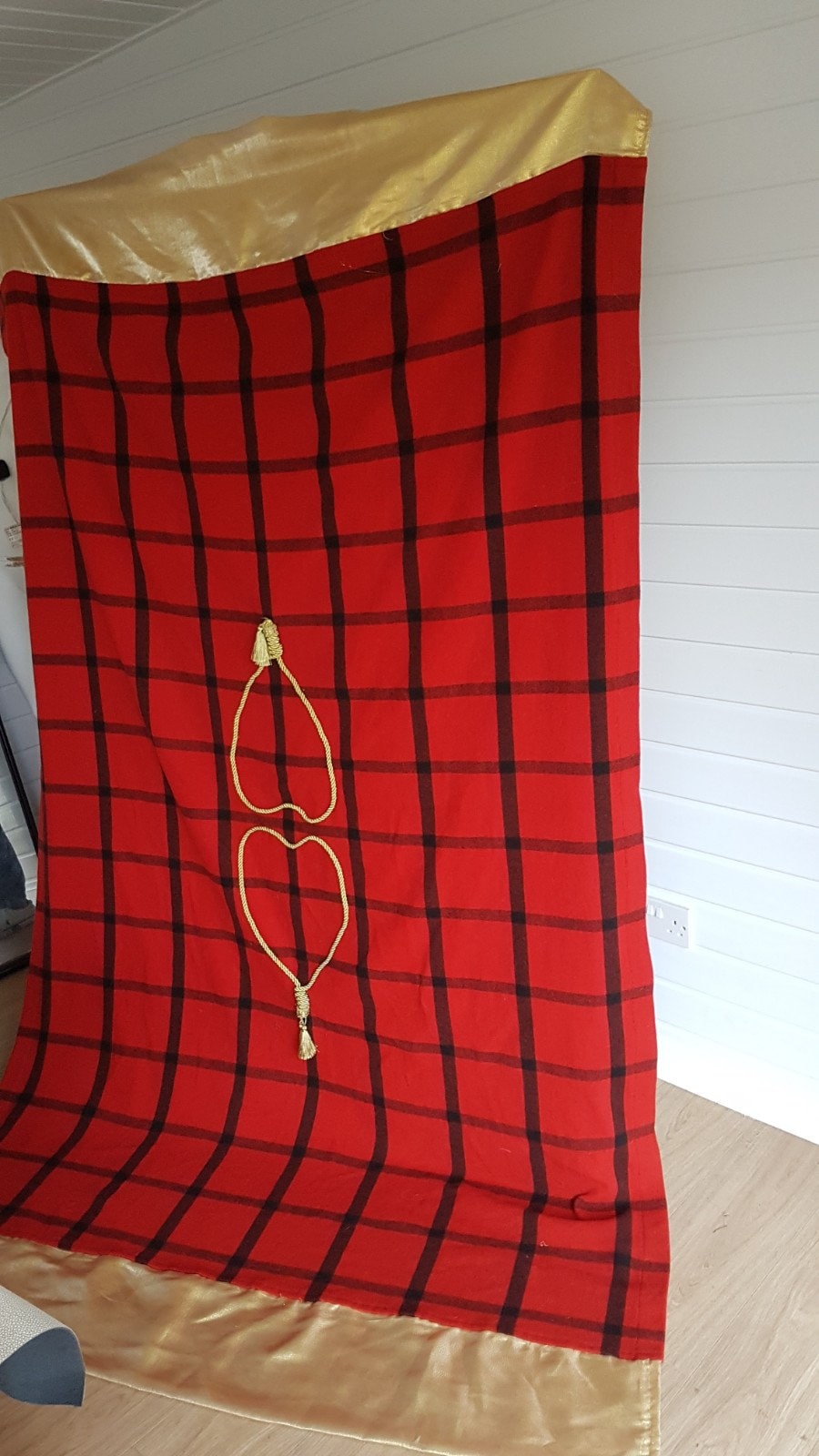 Handmade tartan wool bed throw, embellished with gold rope heart shapes in the middle and organza gold trimmings on both ends.