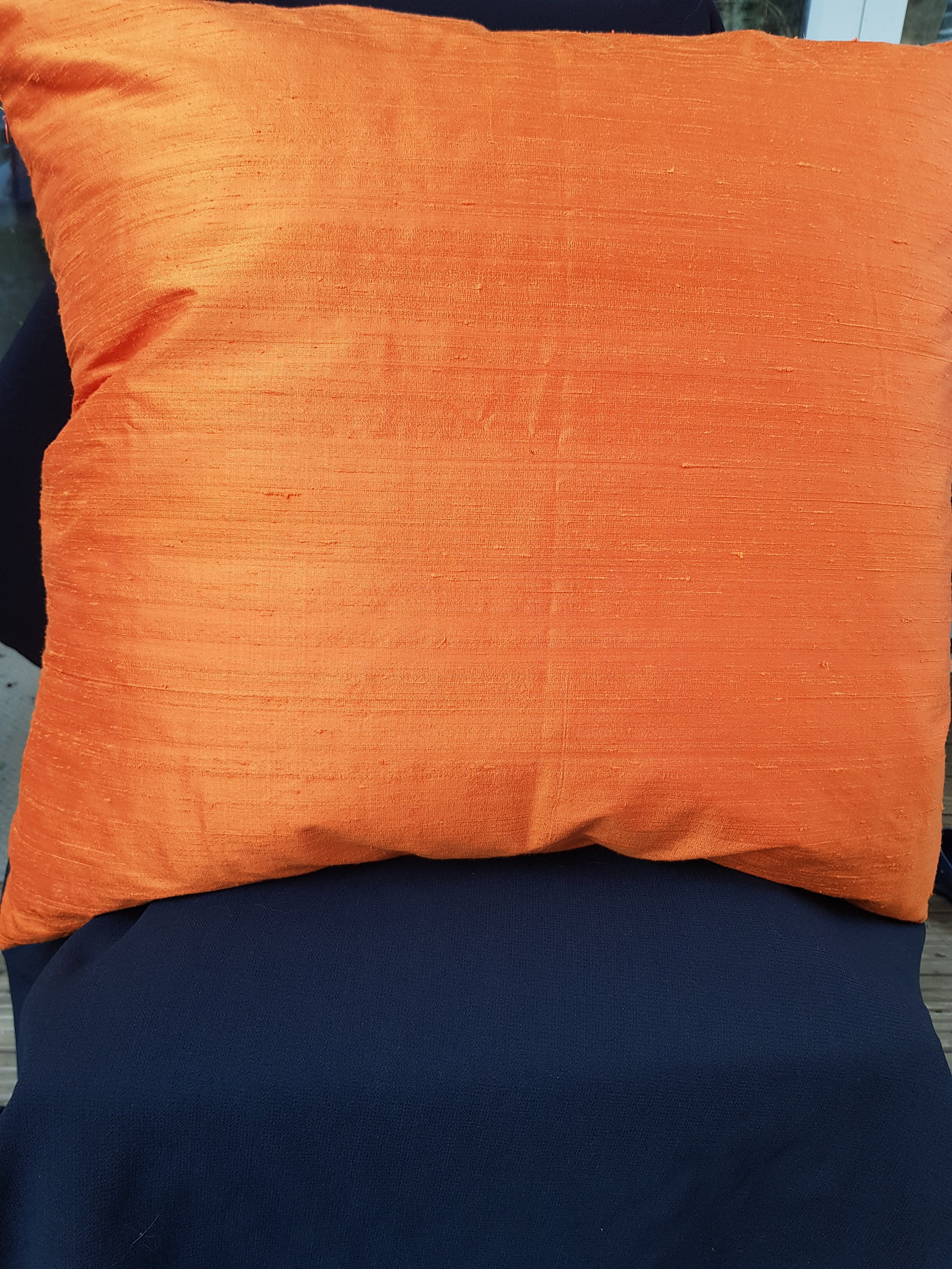 Silk cushion cover with feathered infill 26x26 inches.