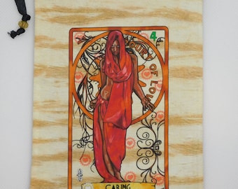 May include: A beige drawstring bag with a woodgrain pattern. The bag features a printed image of a tarot card, the Four of Cups, with a woman in a red robe and the word "Caring" at the bottom.